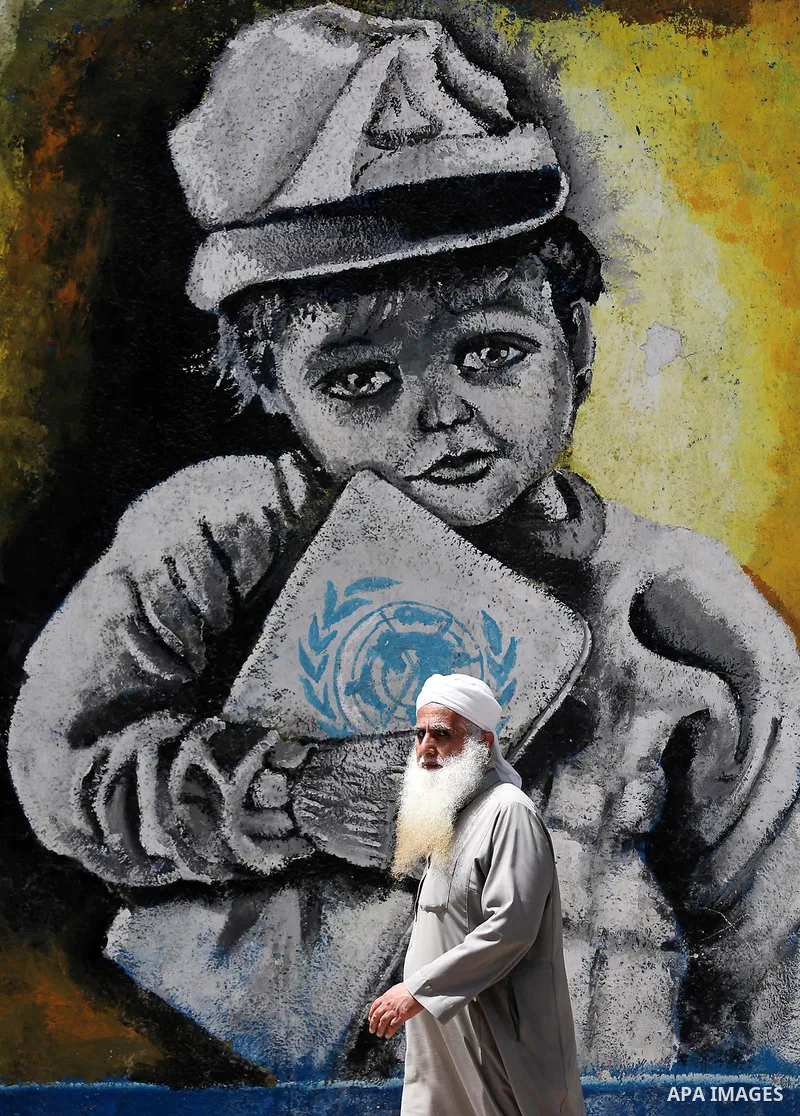 A Palestinian man walks past a mural on the occasion of the 69th anniversary of the "Nakba" or "catastrophe" in Arabic in reference to the establishment in 1948 of the state of Israel, in Gaza city on May 15, 2017. Nakba...