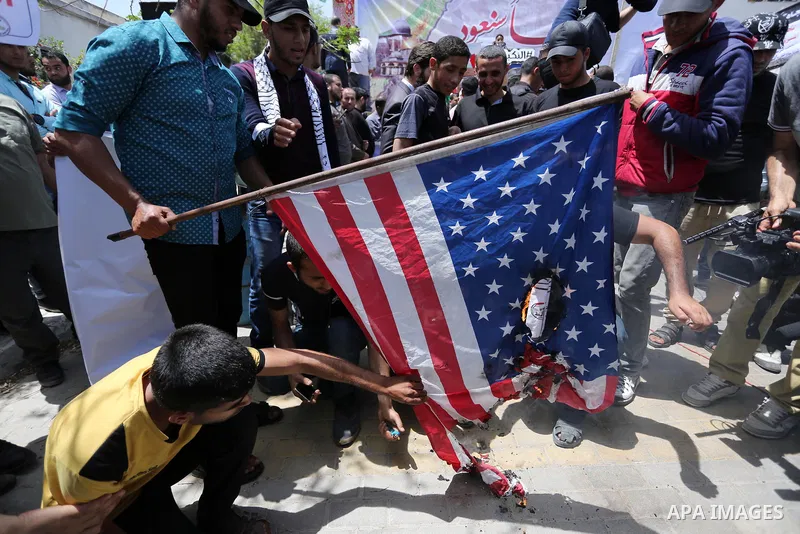 Palestinians burn American flag during a rally to commemorate the 69th anniversary of the "Nakba" in Gaza City, on May 15, 2017. "Nakba" means in Arabic "catastrophe" in reference to the birth of the state of Israel 69-y...