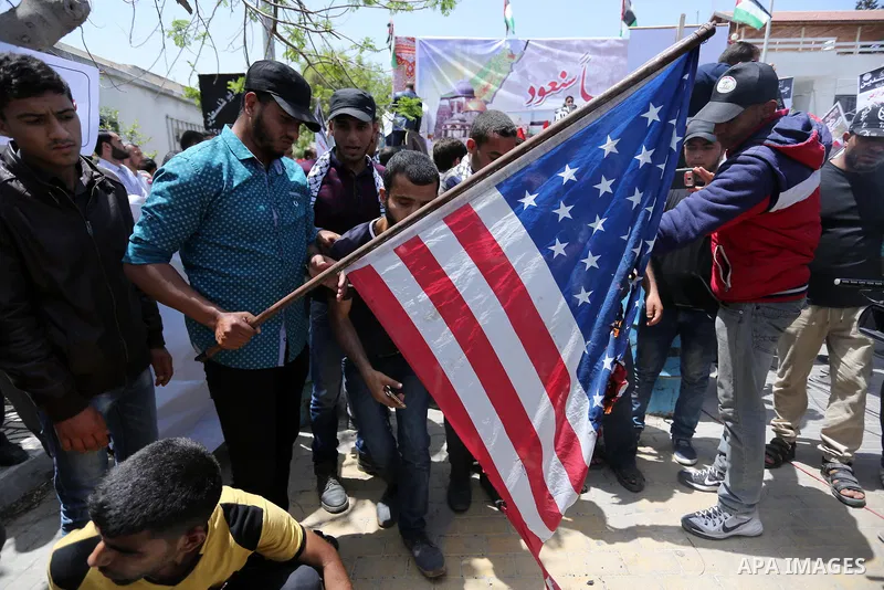 Palestinians burn American flag during a rally to commemorate the 69th anniversary of the "Nakba" in Gaza City, on May 15, 2017. "Nakba" means in Arabic "catastrophe" in reference to the birth of the state of Israel 69-y...