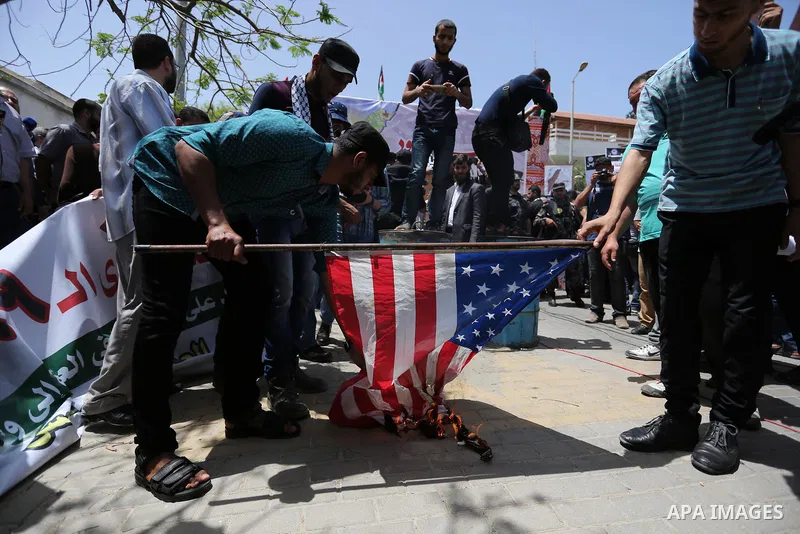 Palestinians burn American flag during a rally to commemorate the 69th anniversary of the "Nakba" in Gaza City, on May 15, 2017. "Nakba" means in Arabic "catastrophe" in reference to the birth of the state of Israel 69-y...