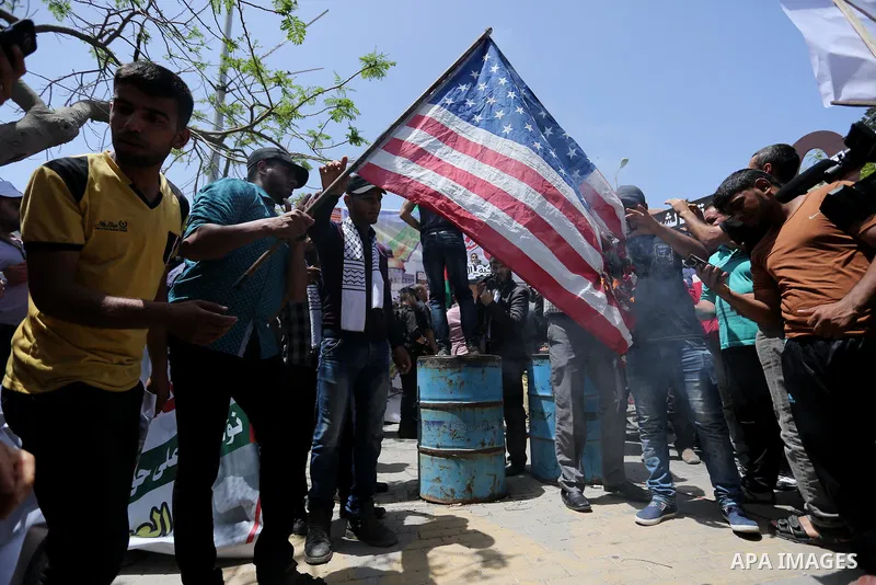 Palestinians burn American flag during a rally to commemorate the 69th anniversary of the "Nakba" in Gaza City, on May 15, 2017. "Nakba" means in Arabic "catastrophe" in reference to the birth of the state of Israel 69-y...