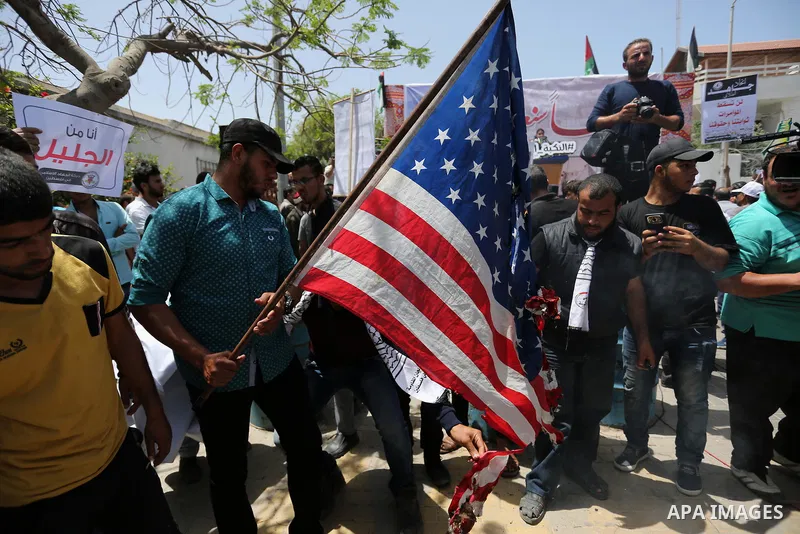 Palestinians burn American flag during a rally to commemorate the 69th anniversary of the "Nakba" in Gaza City, on May 15, 2017. "Nakba" means in Arabic "catastrophe" in reference to the birth of the state of Israel 69-y...