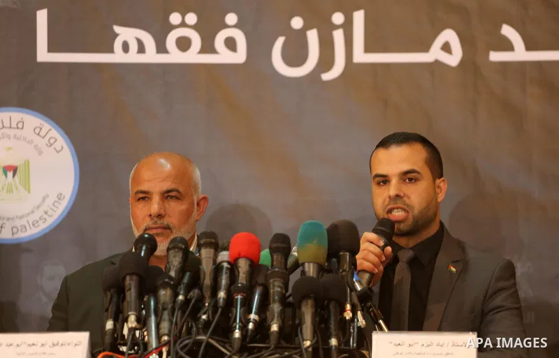 Ayad al-Bouzem, spokesman for the Palestinian Interior Ministry, speaks during a press conference to detect details of the killing one of its key military commanders, Mazen Faqha, who was shot dead on March 24, 2017 near...