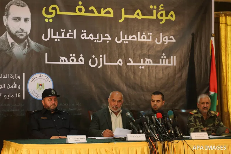Ayad al-Bouzem, spokesman for the Palestinian Interior Ministry, speaks during a press conference to detect details of the killing one of its key military commanders, Mazen Faqha, who was shot dead on March 24, 2017 near...