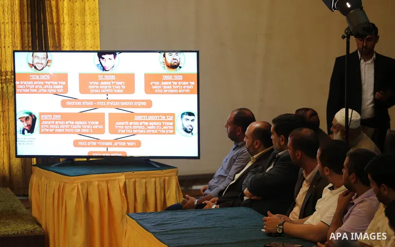 Palestinians attend a press conference to detect details of the killing one of its key military commanders, Mazen Faqha, who was shot dead on March 24, 2017 near his home in Gaza City on May 16, 2017. Photo by Mohammed A...