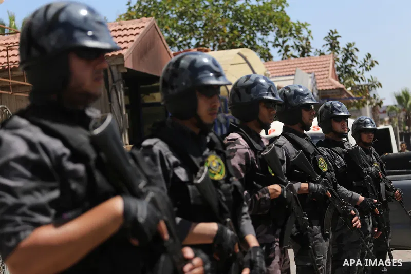 Palestinian policemen stand guard during a press conference to detect details of the killing one of its key military commanders, Mazen Faqha, who was shot dead on March 24, 2017 near his home in Gaza City on May 16, 2017...