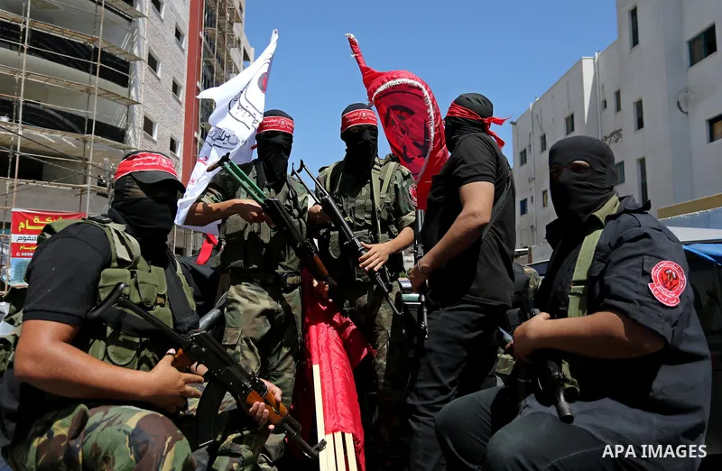 Palestinian mourners carry the body of Mohammed Majed Bakr, a 25-year-old fisherman who died from his injuries after an Israeli patrol vessel fired at a fishing boat, during his funeral in Gaza City on May 16, 2017. The...