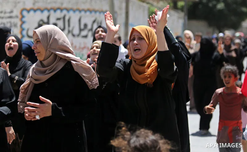 Palestinian women mourn during the funeral of Mohammed Majed Bakr, a 25-year-old fisherman who died from his injuries after an Israeli patrol vessel fired at a fishing boat, in Gaza city on May 16, 2017. The Israeli patr...