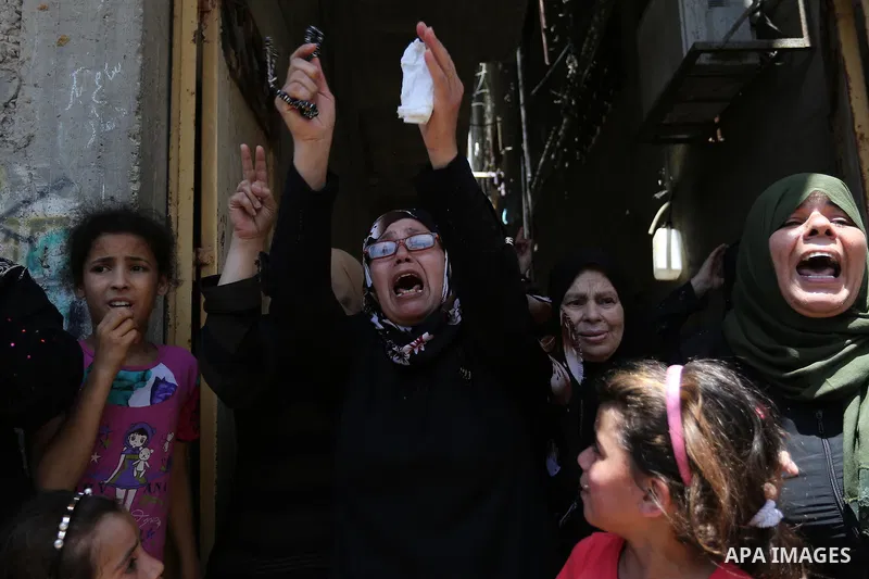Palestinian women mourn during the funeral of Mohammed Majed Bakr, a 25-year-old fisherman who died from his injuries after an Israeli patrol vessel fired at a fishing boat, in Gaza city on May 16, 2017. The Israeli patr...
