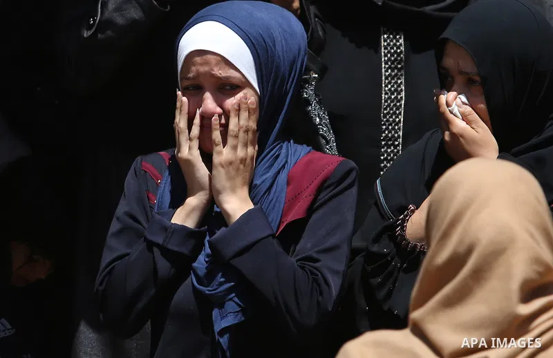 Palestinian women mourn during the funeral of Mohammed Majed Bakr, a 25-year-old fisherman who died from his injuries after an Israeli patrol vessel fired at a fishing boat, in Gaza city on May 16, 2017. The Israeli patr...