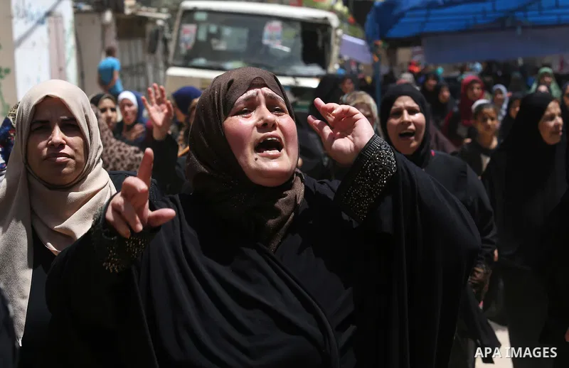 Palestinian women mourn during the funeral of Mohammed Majed Bakr, a 25-year-old fisherman who died from his injuries after an Israeli patrol vessel fired at a fishing boat, in Gaza city on May 16, 2017. The Israeli patr...
