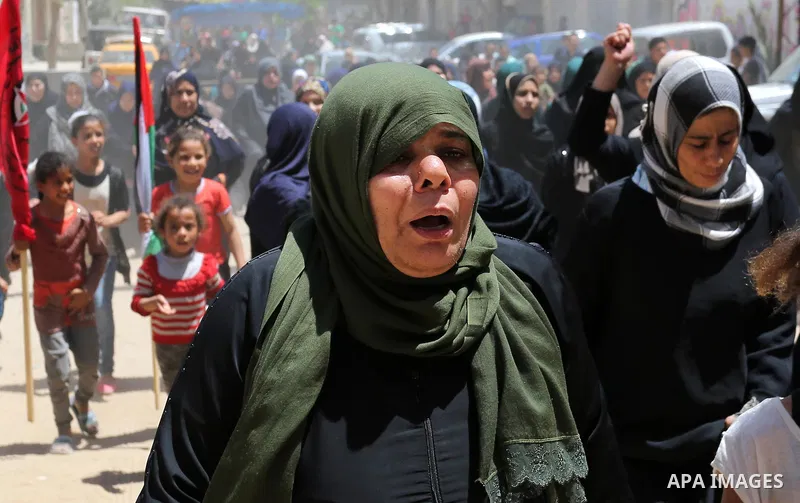 Palestinian women mourn during the funeral of Mohammed Majed Bakr, a 25-year-old fisherman who died from his injuries after an Israeli patrol vessel fired at a fishing boat, in Gaza city on May 16, 2017. The Israeli patr...