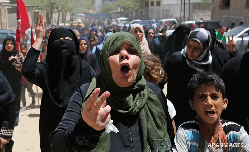 Palestinian women mourn during the funeral of Mohammed Majed Bakr, a 25-year-old fisherman who died from his injuries after an Israeli patrol vessel fired at a fishing boat, in Gaza city on May 16, 2017. The Israeli patr...