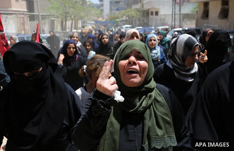 Palestinian women mourn during the funeral of Mohammed Majed Bakr, a 25-year-old fisherman who died from his injuries after an Israeli patrol vessel fired at a fishing boat, in Gaza city on May 16, 2017. The Israeli patr...