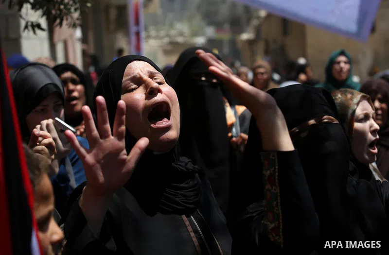 Palestinian women mourn during the funeral of Mohammed Majed Bakr, a 25-year-old fisherman who died from his injuries after an Israeli patrol vessel fired at a fishing boat, in Gaza city on May 16, 2017. The Israeli patr...