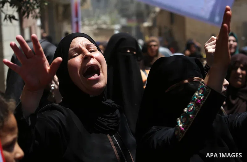 Palestinian women mourn during the funeral of Mohammed Majed Bakr, a 25-year-old fisherman who died from his injuries after an Israeli patrol vessel fired at a fishing boat, in Gaza city on May 16, 2017. The Israeli patr...