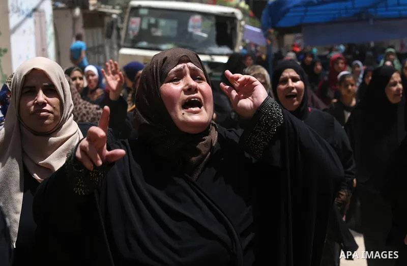 Palestinian women mourn during the funeral of Mohammed Majed Bakr, a 25-year-old fisherman who died from his injuries after an Israeli patrol vessel fired at a fishing boat, in Gaza city on May 16, 2017. The Israeli patr...