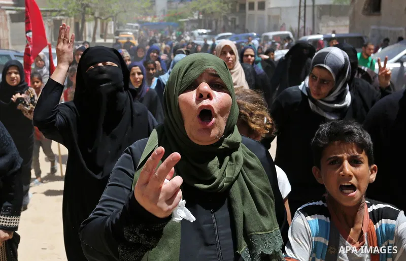 Palestinian women mourn during the funeral of Mohammed Majed Bakr, a 25-year-old fisherman who died from his injuries after an Israeli patrol vessel fired at a fishing boat, in Gaza city on May 16, 2017. The Israeli patr...