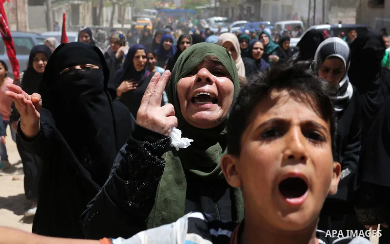 Palestinian women mourn during the funeral of Mohammed Majed Bakr, a 25-year-old fisherman who died from his injuries after an Israeli patrol vessel fired at a fishing boat, in Gaza city on May 16, 2017. The Israeli patr...