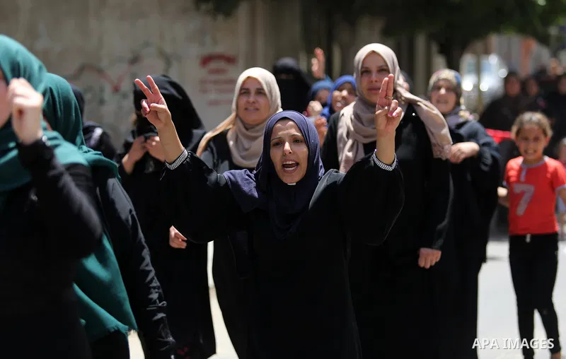 Palestinian women mourn during the funeral of Mohammed Majed Bakr, a 25-year-old fisherman who died from his injuries after an Israeli patrol vessel fired at a fishing boat, in Gaza city on May 16, 2017. The Israeli patr...