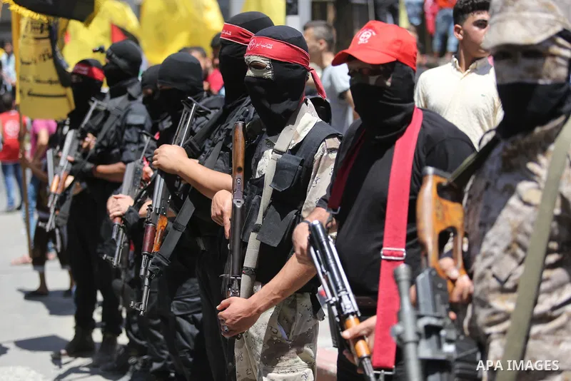 Palestinian mourners carry the body of Mohammed Majed Bakr, a 25-year-old fisherman who died from his injuries after an Israeli patrol vessel fired at a fishing boat, during his funeral in Gaza City on May 16, 2017. The...