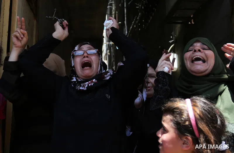 Palestinian women mourn during the funeral of Mohammed Majed Bakr, a 25-year-old fisherman who died from his injuries after an Israeli patrol vessel fired at a fishing boat, in Gaza city on May 16, 2017. The Israeli patr...