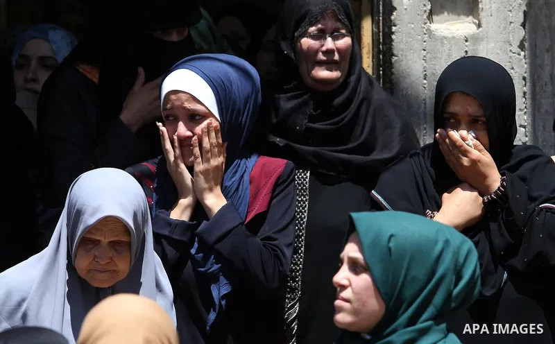 Palestinian women mourn during the funeral of Mohammed Majed Bakr, a 25-year-old fisherman who died from his injuries after an Israeli patrol vessel fired at a fishing boat, in Gaza city on May 16, 2017. The Israeli patr...