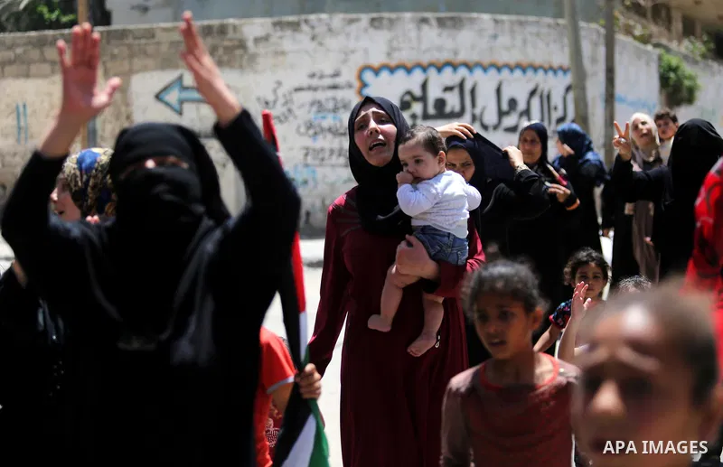 Palestinian women mourn during the funeral of Mohammed Majed Bakr, a 25-year-old fisherman who died from his injuries after an Israeli patrol vessel fired at a fishing boat, in Gaza city on May 16, 2017. The Israeli patr...