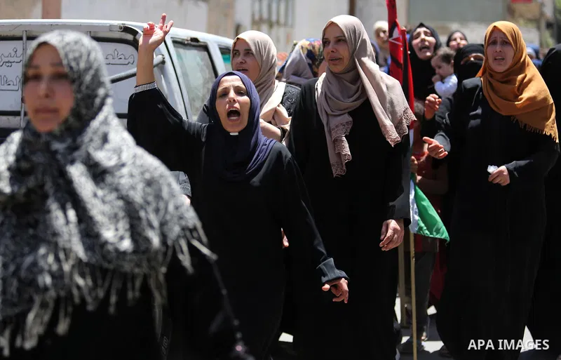 Palestinian women mourn during the funeral of Mohammed Majed Bakr, a 25-year-old fisherman who died from his injuries after an Israeli patrol vessel fired at a fishing boat, in Gaza city on May 16, 2017. The Israeli patr...