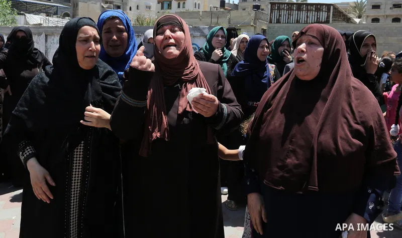 Palestinian women mourn during the funeral of Mohammed Majed Bakr, a 25-year-old fisherman who died from his injuries after an Israeli patrol vessel fired at a fishing boat, in Gaza city on May 16, 2017. The Israeli patr...