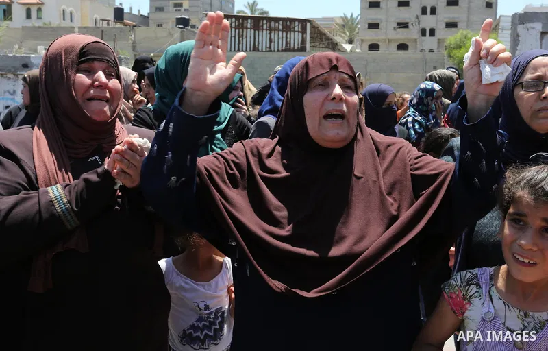 Palestinian women mourn during the funeral of Mohammed Majed Bakr, a 25-year-old fisherman who died from his injuries after an Israeli patrol vessel fired at a fishing boat, in Gaza city on May 16, 2017. The Israeli patr...