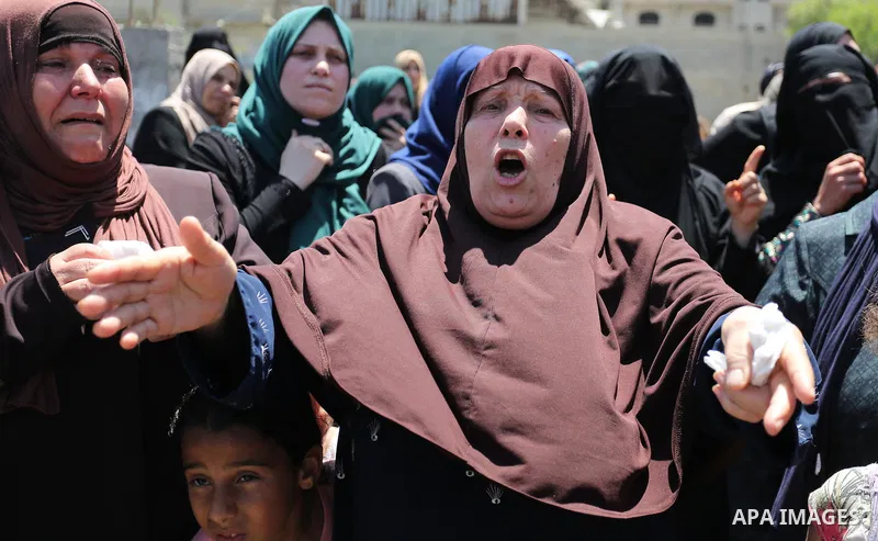 Palestinian women mourn during the funeral of Mohammed Majed Bakr, a 25-year-old fisherman who died from his injuries after an Israeli patrol vessel fired at a fishing boat, in Gaza city on May 16, 2017. The Israeli patr...