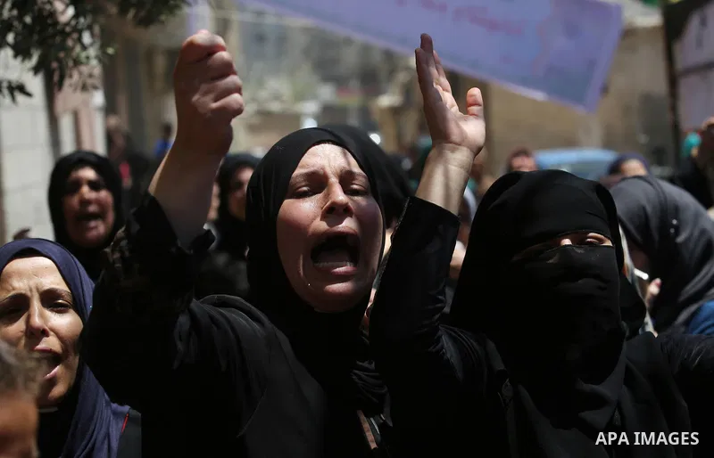 Palestinian women mourn during the funeral of Mohammed Majed Bakr, a 25-year-old fisherman who died from his injuries after an Israeli patrol vessel fired at a fishing boat, in Gaza city on May 16, 2017. The Israeli patr...