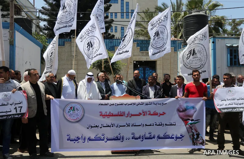 Palestinian supporters of Al-Ahrar movement take part in a protest to show solidarity with Palestinian prisoners on hunger strike in Israeli jails in front of the high commissioner for human rights headquarters, in Gaza...