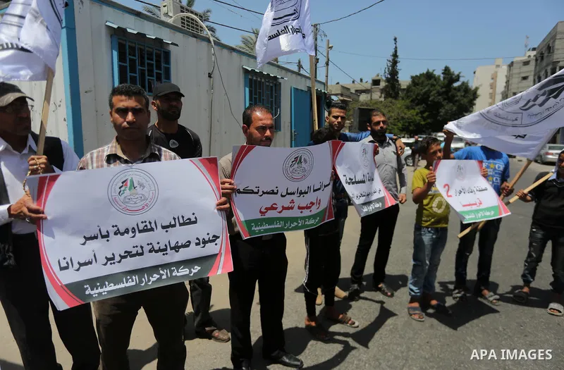 Palestinian supporters of Al-Ahrar movement take part in a protest to show solidarity with Palestinian prisoners on hunger strike in Israeli jails in front of the high commissioner for human rights headquarters, in Gaza...
