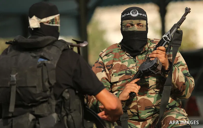Representatives of various Palestinian armed factions take part in a news conference in support of Palestinian prisoners on hunger strike in Israeli jails, in Gaza City May 18, 2017. Photo by Ashraf Amra