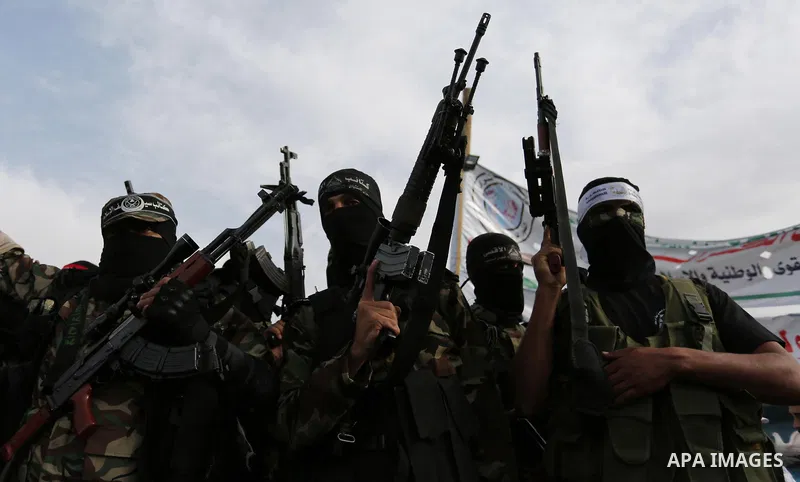 Representatives of various Palestinian armed factions take part in a news conference in support of Palestinian prisoners on hunger strike in Israeli jails, in Gaza City May 18, 2017. Photo by Ashraf Amra