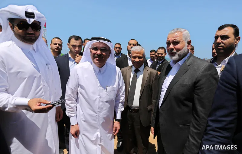 Ismail Haniyeh, leader of Hamas and Qatar's Ambassador to the Palestinian Authority, Mohammed Al Emadi attend the ceremony of establishment of the headquarters of the Gaza reconstruction commission, in the west of Gaza c...