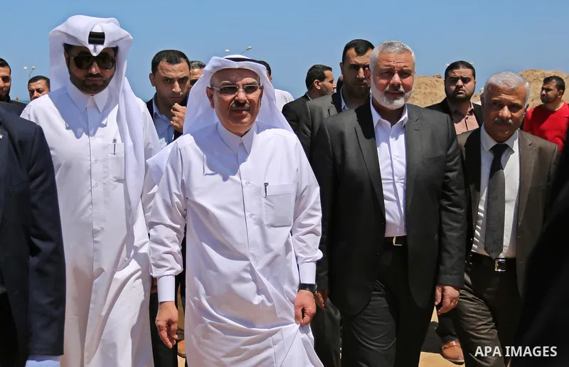 Ismail Haniyeh, leader of Hamas and Qatar's Ambassador to the Palestinian Authority, Mohammed Al Emadi attend the ceremony of establishment of the headquarters of the Gaza reconstruction commission, in the west of Gaza c...