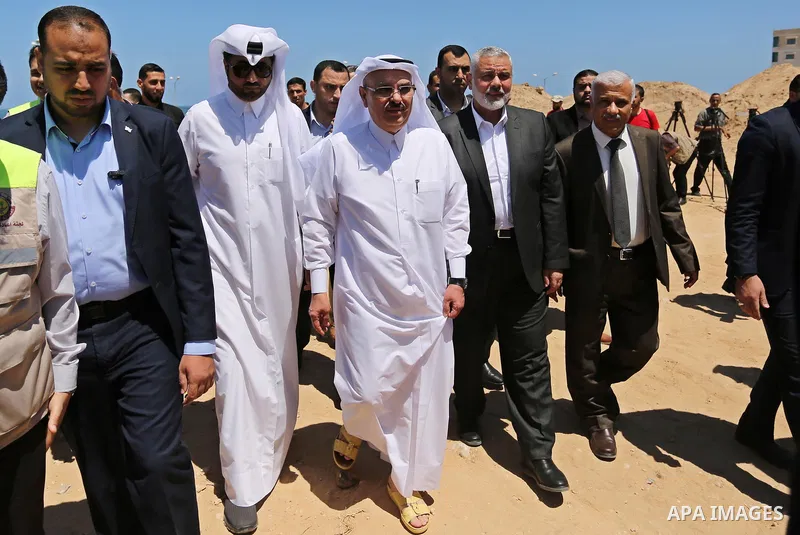 Ismail Haniyeh, leader of Hamas and Qatar's Ambassador to the Palestinian Authority, Mohammed Al Emadi attend the ceremony of establishment of the headquarters of the Gaza reconstruction commission, in the west of Gaza c...