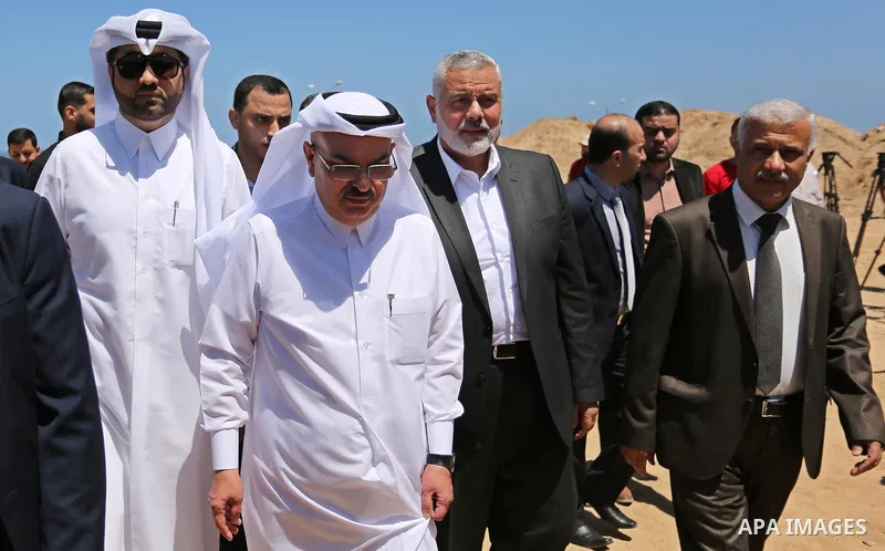 Ismail Haniyeh, leader of Hamas and Qatar's Ambassador to the Palestinian Authority, Mohammed Al Emadi attend the ceremony of establishment of the headquarters of the Gaza reconstruction commission, in the west of Gaza c...