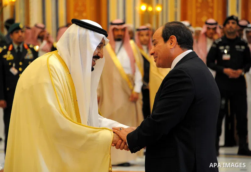 Egyptian President Abdel Fattah al-Sisi shakes hands with Saudi Arabia's King Salman bin Abdulaziz al-Saud, during the Arab American Islamic summit in the Saudi capital Riyadh on May 21. 2017. Photo by Egyptian President...
