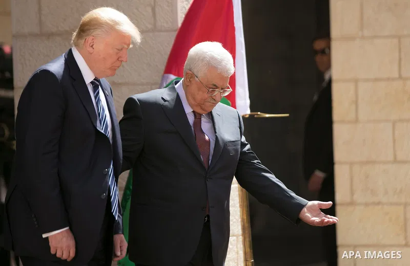 U.S. President Donald Trump and Palestinian President Mahmoud Abbas review the honor guard during a reception ceremony at the presidential headquarters in the West Bank town of Bethlehem, May 23, 2017. APAIMAGES/Fadi Aro...
