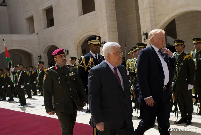 U.S. President Donald Trump and Palestinian President Mahmoud Abbas review the honor guard during a reception ceremony at the presidential headquarters in the West Bank town of Bethlehem, May 23, 2017. APAIMAGES/Fadi Aro...