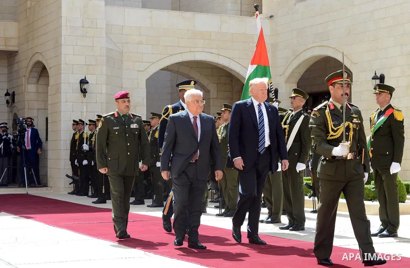U.S. President Donald Trump and Palestinian President Mahmoud Abbas review the honor guard during a reception ceremony at the presidential headquarters in the West Bank town of Bethlehem, May 23, 2017. Photo by Thaer Gan...