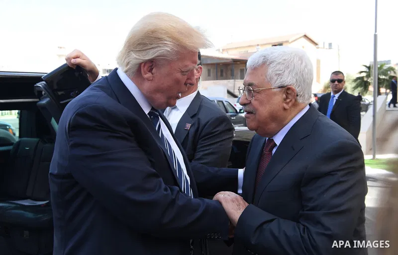 U.S. President Donald Trump and Palestinian President Mahmoud Abbas review the honor guard during a reception ceremony at the presidential headquarters in the West Bank town of Bethlehem, May 23, 2017. Photo by Thaer Gan...