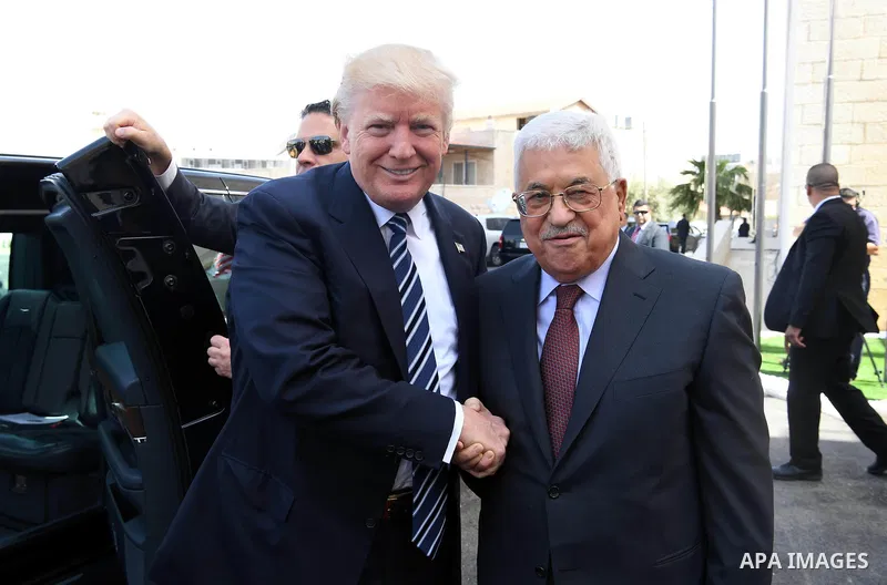 U.S. President Donald Trump and Palestinian President Mahmoud Abbas review the honor guard during a reception ceremony at the presidential headquarters in the West Bank town of Bethlehem, May 23, 2017. Photo by Thaer Gan...
