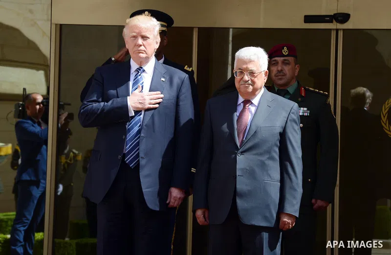 U.S. President Donald Trump and Palestinian President Mahmoud Abbas review the honor guard during a reception ceremony at the presidential headquarters in the West Bank town of Bethlehem, May 23, 2017. Photo by Thaer Gan...