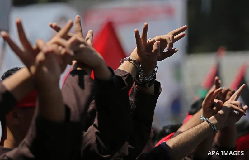 Palestinian demonstrators take part in a protest in support of Palestinian prisoners held in Israeli jails and against the visit of U.S. President Donald Trump, in Gaza City May 23, 2017. Photo by Ashraf Amra