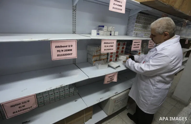 A Palestinian director checks the Ministry of Health stores, in Gaza city, on May 23, 2017. Photo by Mohammed Asad